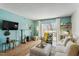 Inviting living room with a fireplace, bright walls, and large sliding doors to an outdoor balcony at 311 Swift Ave Ave # 202, Durham, NC 27705