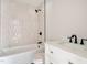 Updated bathroom with shower over tub, modern vanity with granite countertops at 312 W Union St, Hillsborough, NC 27278