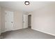 This bedroom features neutral paint, carpet flooring, two doors, and overhead lighting at 312 W Union St, Hillsborough, NC 27278