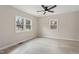 Bright bedroom with light wood flooring, neutral paint, and large windows at 312 W Union St, Hillsborough, NC 27278