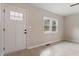 Bright entryway featuring a white front door, wood-look floors, and neutral paint at 312 W Union St, Hillsborough, NC 27278