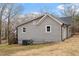 Rear exterior view of home with siding, windows, and an access door to the crawlspace at 312 W Union St, Hillsborough, NC 27278