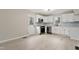 Modern kitchen with white cabinets, stainless steel appliances, and a subway tile backsplash at 312 W Union St, Hillsborough, NC 27278
