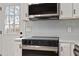 Modern kitchen featuring stainless steel microwave and oven with white countertops at 312 W Union St, Hillsborough, NC 27278
