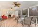 Relaxing screened porch with fireplace, ceiling fans, and comfortable seating area at 3320 Tree Farm Rd, Hillsborough, NC 27278