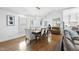 Dining room with hardwood floors, neutral walls, large dining table with seating and a window at 400 Edinburgh Dr, Cary, NC 27511