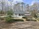 Charming single-Gathering home featuring a landscaped front yard, black shutters, and a classic white exterior at 400 Edinburgh Dr, Cary, NC 27511