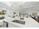 Bright, open kitchen with a large island, stainless steel appliances, and modern white cabinetry at 400 Edinburgh Dr, Cary, NC 27511