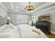 Spacious main bedroom with hardwood floors, tray ceiling, and a large window at 400 Edinburgh Dr, Cary, NC 27511
