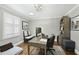 Bright home office features hardwood floors, natural light, a desk, seating and shelving at 400 Edinburgh Dr, Cary, NC 27511