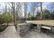 Outdoor grill station featuring stone surround, stainless steel grill, and countertop; perfect for outdoor cooking at 400 Edinburgh Dr, Cary, NC 27511