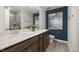 Modern bathroom with dual vanity, wood cabinets, neutral wall color and tiled shower at 4002 Kidd Pl, Durham, NC 27703