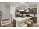 Bright kitchen with granite island, pendant lighting, and stainless steel appliances at 4002 Kidd Pl, Durham, NC 27703