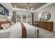 Bright main bedroom with tray ceilings, large windows, and neutral decor at 4002 Kidd Pl, Durham, NC 27703