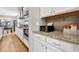 Modern kitchen with stainless steel appliances, white cabinets, granite countertops, and subway tile backsplash at 4305 Field Oak Dr, Wake Forest, NC 27587