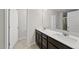 Modern bathroom featuring a double vanity, white countertop, and neutral color palette at 449 Willard Woods Dr, Wendell, NC 27591