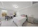 Bright bedroom with a tray ceiling, two windows, and carpeted floors at 449 Willard Woods Dr, Wendell, NC 27591