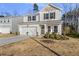 Charming two-story home featuring a two-car garage and manicured front yard at 449 Willard Woods Dr, Wendell, NC 27591