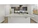 Modern kitchen with a large granite island and stainless steel appliances at 449 Willard Woods Dr, Wendell, NC 27591