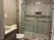 Modern bathroom featuring a glass shower enclosure and sleek vanity at 4807 Tyne Drive, Durham, NC 27703