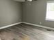 Bedroom featuring luxury vinyl flooring and a window at 4807 Tyne Drive, Durham, NC 27703