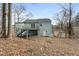 Back exterior featuring a deck, siding, and landscaping at 4807 Tyne Drive, Durham, NC 27703