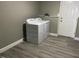 Functional laundry area featuring a white washer and dryer set next to a door at 4807 Tyne Drive, Durham, NC 27703