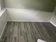 This room has gray vinyl flooring, chair railing, and white baseboards at 4807 Tyne Drive, Durham, NC 27703