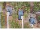 The birds-eye view displays the property's layout, wooded landscape, and neighborhood setting at 49 Bonterra Way, Chapel Hill, NC 27516