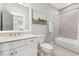 Bright bathroom with a tub, shower, and marble countertops at 49 Bonterra Way, Chapel Hill, NC 27516