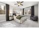 Serene bedroom with plush carpet, large windows, and a ceiling fan at 49 Bonterra Way, Chapel Hill, NC 27516