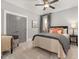 Cozy bedroom with a ceiling fan, soft carpet, and calming gray walls at 49 Bonterra Way, Chapel Hill, NC 27516