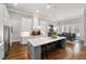 Gourmet kitchen boasts a large center island, stainless appliances, and eat in dining area at 49 Bonterra Way, Chapel Hill, NC 27516