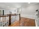 Spacious living room with hardwood floors, wainscoting, and abundant natural light at 49 Bonterra Way, Chapel Hill, NC 27516