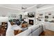 Cozy living room with fireplace, built-in shelving, and comfortable seating at 49 Bonterra Way, Chapel Hill, NC 27516