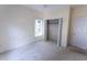 Bedroom with carpet, white walls, and an open closet at 4909 Willow Tree Ln, Clayton, NC 27520