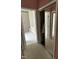 View of bathroom access from hallway, plus closet at 4909 Willow Tree Ln, Clayton, NC 27520