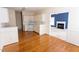 Open kitchen featuring white appliances, cabinets, and hardwood floors at 4909 Willow Tree Ln, Clayton, NC 27520