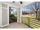 A relaxing patio offers great neighborhood views with black metal railing and white posts at 501 Finsbury St # 100, Durham, NC 27703