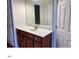 Bathroom vanity with a white countertop and wood cabinets at 501 Liberty Rose Dr, Morrisville, NC 27560