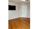 Bedroom with hardwood floors and a TV at 501 Liberty Rose Dr, Morrisville, NC 27560