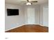 Spacious bedroom features a ceiling fan, mounted TV, and hardwood floors at 501 Liberty Rose Dr, Morrisville, NC 27560