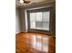 Bright bedroom featuring gleaming hardwood floors and a large window for plenty of natural light at 501 Liberty Rose Dr, Morrisville, NC 27560