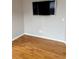 Cozy bedroom showcasing hardwood floors and a modern TV at 501 Liberty Rose Dr, Morrisville, NC 27560