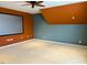 Large bonus room featuring a media screen, neutral carpet, and a ceiling fan at 501 Liberty Rose Dr, Morrisville, NC 27560