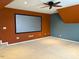 Bonus room with carpet, ceiling fan, neutral colored walls and a large media screen at 501 Liberty Rose Dr, Morrisville, NC 27560