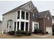 Two story home with mixed siding, brick and a covered front porch with upper balcony at 501 Liberty Rose Dr, Morrisville, NC 27560
