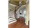 Elegant foyer with hardwood floors, staircase and trim work at 501 Liberty Rose Dr, Morrisville, NC 27560