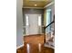 Spacious foyer with hardwood floors and a striking front door, highlighted by elegant trim and staircase at 501 Liberty Rose Dr, Morrisville, NC 27560