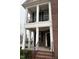 View of the home's classic front porch and brick exterior at 501 Liberty Rose Dr, Morrisville, NC 27560